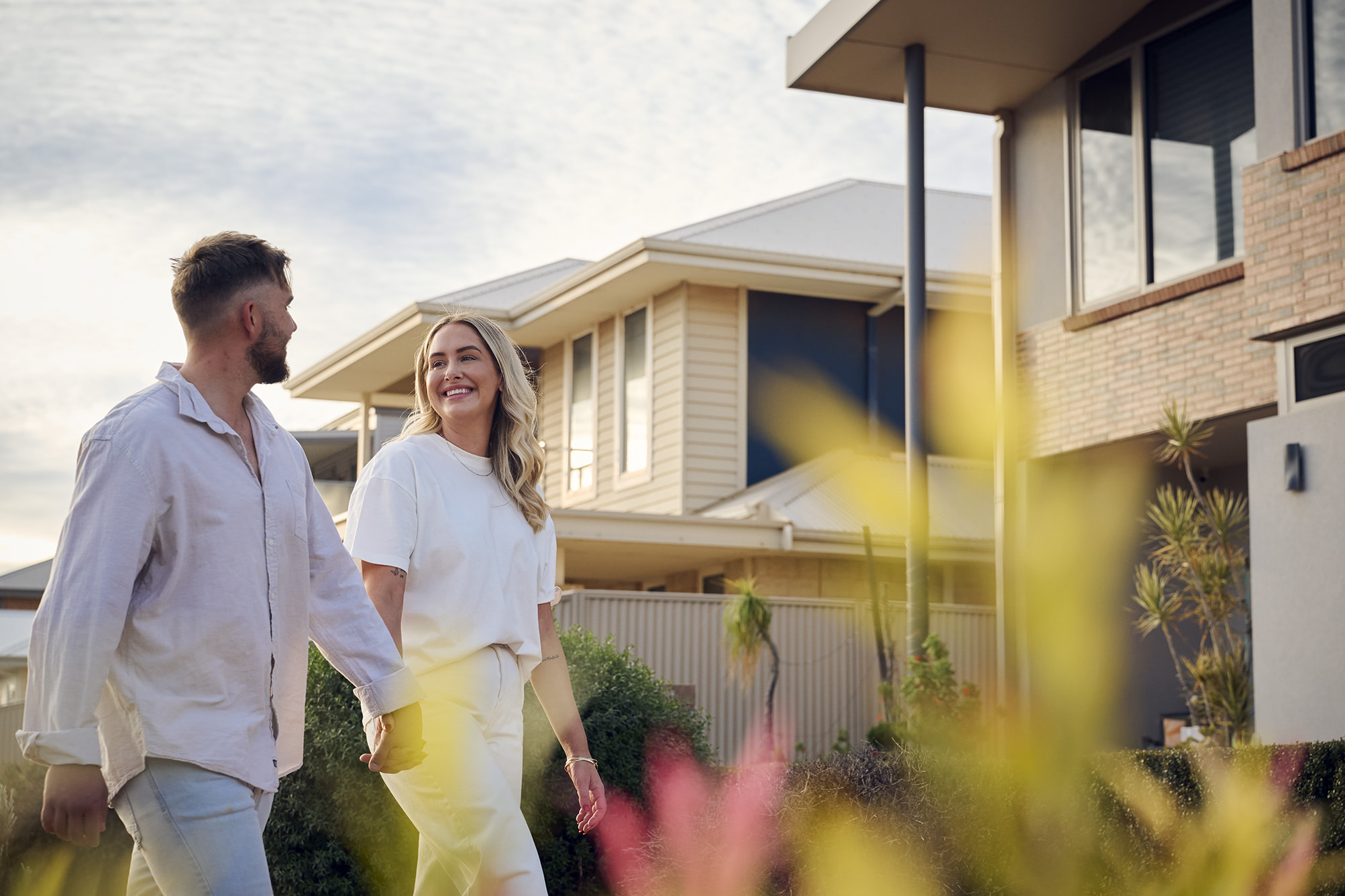 A couple strolling in their neighbourhood in Greenview Karlkurla Estate